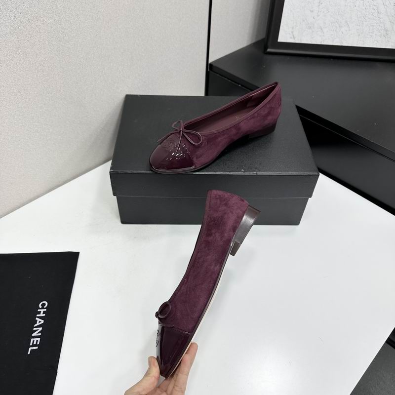 Chanel burgundy suede ballet flats with patent cap-toe and bow detail, shown from multiple angles against a black shoebox